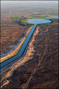 Slowly flowing from Lake Wetherell, canals of the Darling River cut through the flat, arid countryside near Menindee, New South Wales. Use left and right arrows to navigate through all images.
