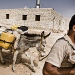 Water is transported from a well near Hebron.