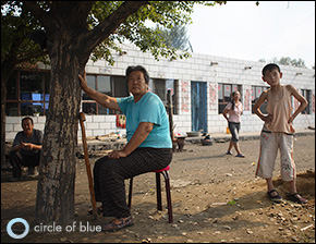 Yangxiumei, 59, sits in front of her house near Baogang, Inner Mongolia. Like many others in her village, she suffers from a debilitating bone disease that has made her leg go lame. Many locals believe that their health problems are caused by polluted water. Click image to enlarge. Yangxiumei, 59, sits in front of her house near Baogang, Inner Mongolia. Like many others in her village, she suffers from a debilitating bone disease that has made her leg go lame. Many locals believe that their health problems are caused by polluted water. Click image to enlarge.