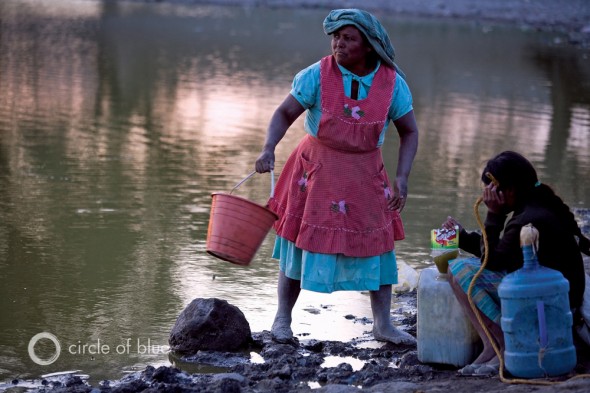 Stocking up on water, since the village's supplies are limited. Tehuacan Mexico drought supply pollution farm farmer water electricity infrastructure j. carl ganter