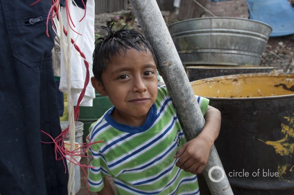 Carlos Silva receives meager amounts of water in Mexico City's urban area. Mexico City Iztapalapa urban water drought supply pollution j. carl ganter