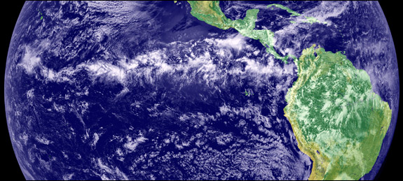 In the intertropical convergence zone, an area just north of the equator, northern and southern trade winds collide and form thick clouds as the tropical sun warms the atmosphere. This image is a combination of cloud data from NOAA’s Geostationary Operational Environmental Satellite and color land cover classification data. Image courtesy of NASA/JPL.
