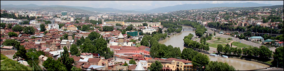 The Kura River winds through Tbilisi, the capital of Georgia, amid banks crowned with houses and old churches. From Tbilisi, the river flows east and gradually broadens into an extensive lowland as it nears Azerbaijan.