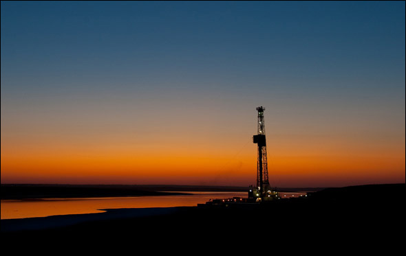 STANLEY, NORTH DAKOTA, SEPTEMBER 2009: An oil drilling rig on the Bakken Shale formation at sunset.