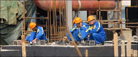 Chinese workers rest at the construction site of Tianjin’s GreenGen coal-fired gasification power plant, scheduled to start operations in 2011. The project is at the head of a pack of Chinese power plants designed to burn coal more efficiently, use less water, and develop and prove carbon capture and storage techniques.