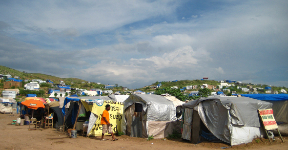 Haiti cholera earthquake health disease epidemic outbreak tent camp water sanitation latrine