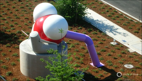 At the end of Brightwater's entry road visitors see a representation of a water molecule, designed by Buster Simpson. The molecule is also the starting point for Simpson's "purple pipe" sculpture.