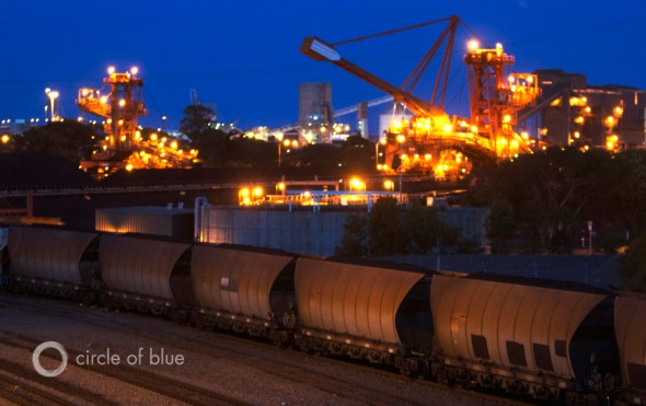 Coal trains line up at twilight to offload their dusty cargo at the Port of Newcastle in New South Wales, Australia.