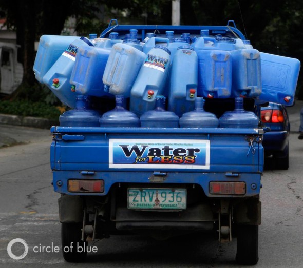 Refillable water containers Manila east Zone philippines privatization slum cuatro squatter village truck