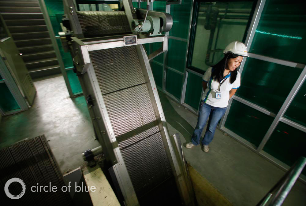 A Manila Water Company representative gives a tour of one of the company’s wastewater treatment plants, located along the banks of the Pasig River.