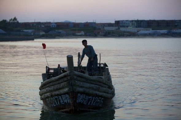 china aquaculture shandong aoshawei bay quindao dawn morning fishing boat