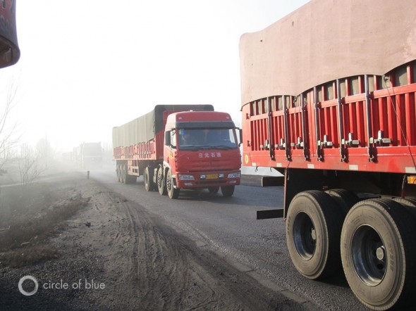 China coal reserves trucks desert climate change mining industry pollution