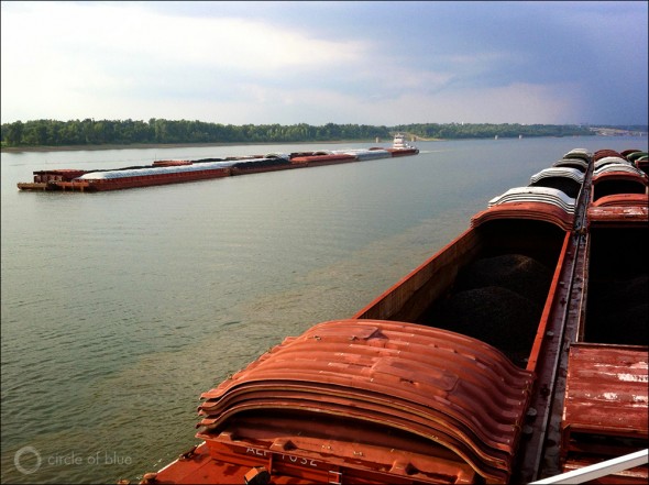 The volume of coal transported on the Ohio River dropped 10 percent in 2012 as utilities switched to burning more natural gas to generate electricity. Here two river tows pass on the Ohio River downstream from Paducah, KY.