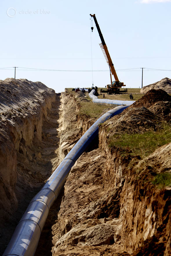 Construction crews install a new water pipeline that will connect to a reservoir near Xilinhot.