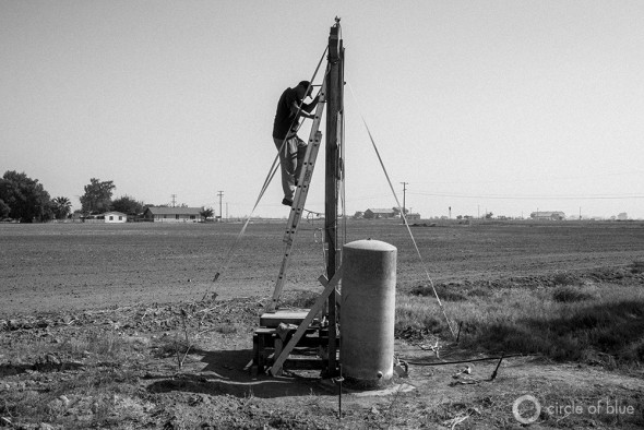 Dropping water tables and a shorted pump resulted in Louis Coronado's water well going dry. He said he was unable to contract a professional driller because they are busy drilling new wells for area farmers, so built this scaffolding and repaired the well himself.