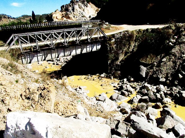 Unregulated sand mining along Meghalaya's river banks turns streams yellow.
