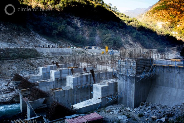 The 99-megawatt Singoli-Bhatwari Hydroelectric Project on the Mandakini River near Okund was so aggressively pummeled by floodwaters and boulders that big chunks of concrete were gouged out of its base and the patches of steel reinforcing rods of two support towers were bent like broken fingers. Photo: Dhruv Malhotra