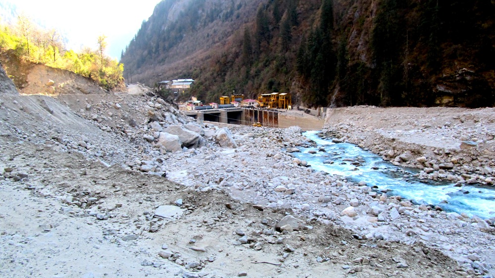 India Uttarakhand flood hydropower dams Himalaya climate change