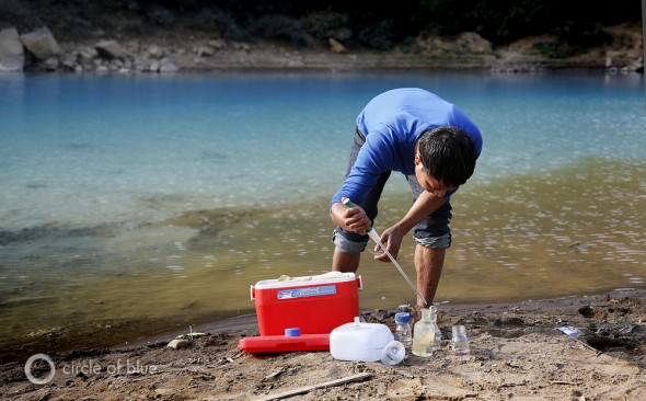 On the banks of the other wordly-blue Lukha River, Arshister Lyngdoh, a zoologist with the Meghalaya Pollution Control Board, tests the acidity of the water. It measured a pH of 4.5, sufficiently acidic to kill fish.