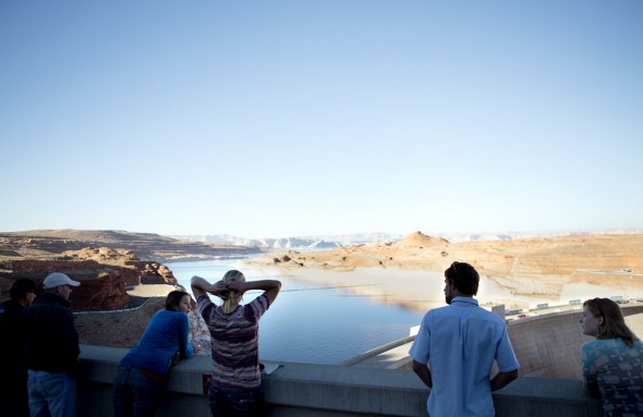 Students look over Lake Powell from the Glen Canyon Dam during an educational trip about water and energy on the Upper Colorado River with Eco-Flight.