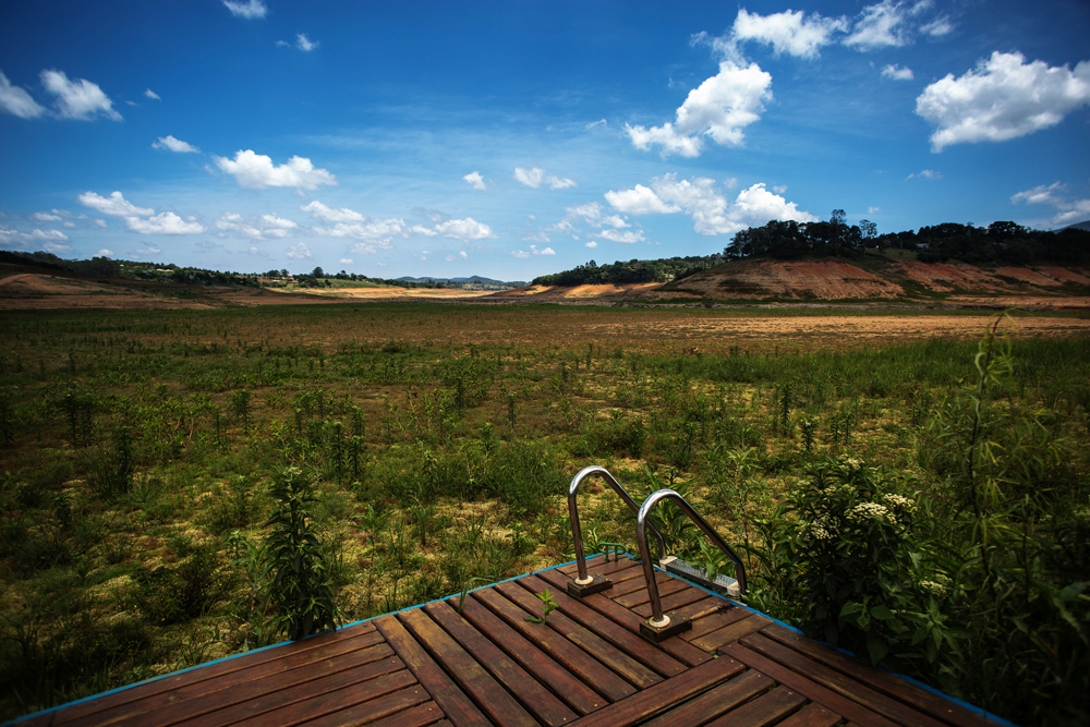 Water levels in Sao Paulo’s Cantareira Reservoir system, shown here in November 2014, sank dangerously low during a two-year drought. Pollution in the city's other reservoirs compounded the problem. Photo courtesy Ninja Midia via Flickr Creative Commons