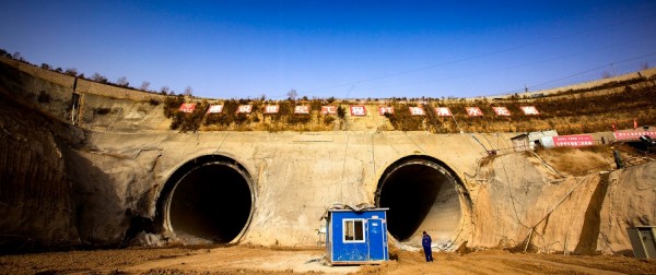 Photo © Aaron Jaffe / Circle of Blue The dark openings of two pipelines beneath the Yellow River, like eyes on a flat face of dirt and rock, are unblinking witnesses to the South-North Water Transfer Project.