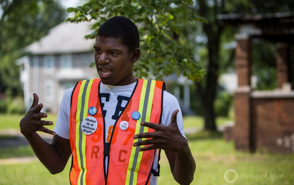 DeMeeko Williams works with the Detroit Water Brigade, a community response group that works to bring emergency relief to families who face water shut-offs. In this August 2014 photo, Williams describes taking calls for weeks over the summer, when thousands of families had water service cut off.