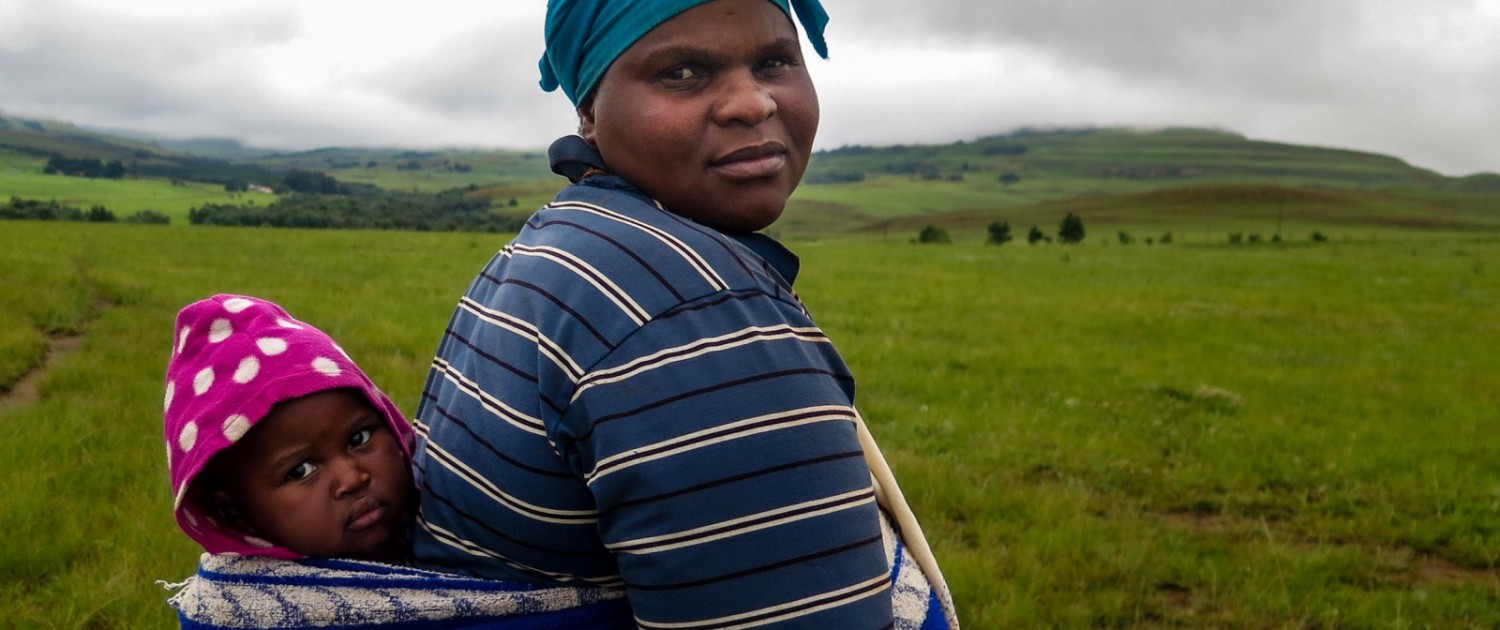 Zulu villagers in the Vryheid region are nervous about new coal mine proposals. Juliette Ndosi and her son, Tobi, live in a family compound near a proposed mine. The project might mean job opportunities, she said. It could also force her family to move. Photo © Keith Schneider / Circle of Blue