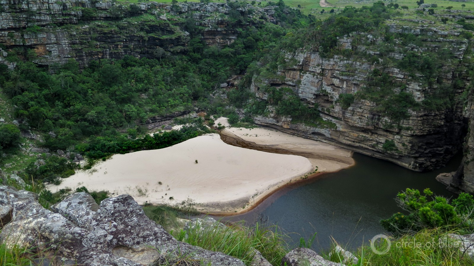 Pondoland is one of the Earth’s stupendously beautiful places. Its sheer basalt cliffs drop straight into deep gorges and the blue waters of the Indian Ocean. Miles of mineral sand beaches attract waves of shore birds and schools of fish. Photo © Keith Schneider / Circle of Blue