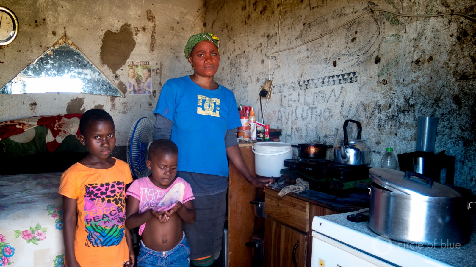A laid off sugar cane farmworker and her children in Pongola.