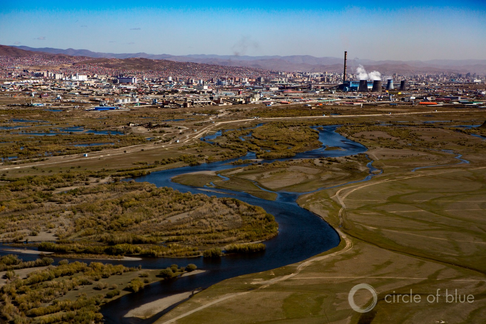 Coal-fired power in Ulan Bator, Mongolia. Much of the analysis on financial losses focuses on the plunge in oil and coal prices, and the potential that a huge portion of the global reserves of oil, gas, and coal will be “stranded’ in the ground to curb climate change. Photo © J. Carl Ganter / Circle of Blue