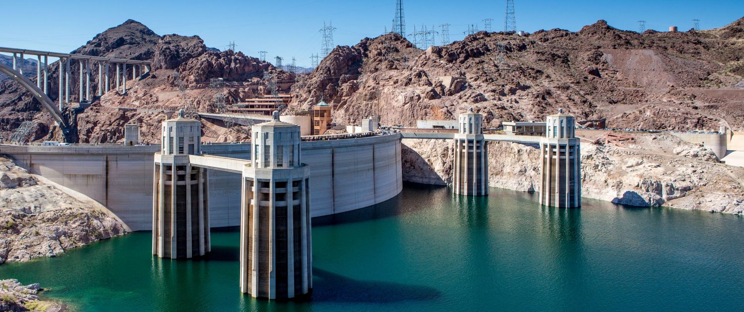 Power lines sweep outward from Hoover Dam, the largest hydropower facility in the U.S. Southwest. Because water levels in Lake Mead have plummeted, power customers have invested in equipment upgrades that will keep the dam operating in low-water conditions. Photo © J. Carl Ganter