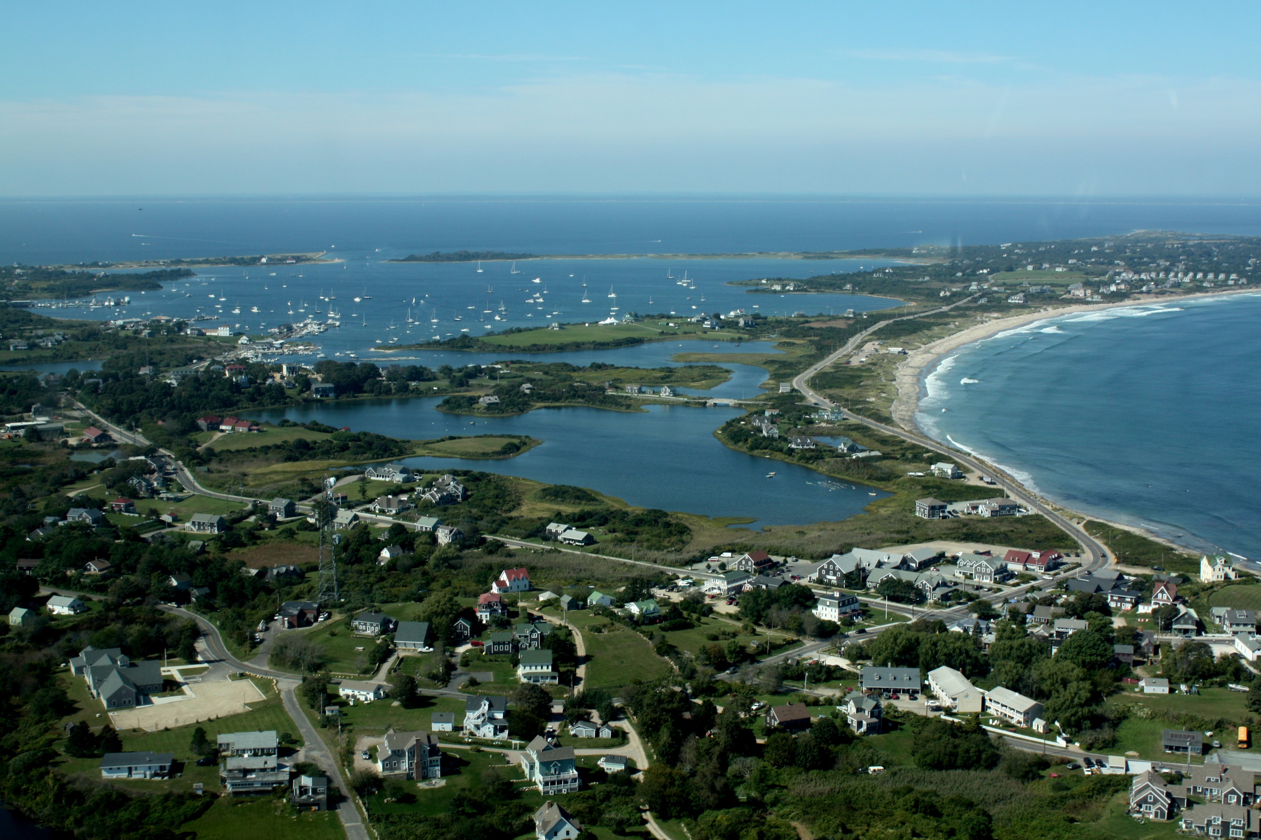 Block Island and the Rhode Island coast are dotted with homes, many of which use septic systems to dispose of toilet waste. Rising sea levels will render these systems less effective at removing bacteria and nutrients. Photo courtesy of Flickr/Creative Commons user eatswords