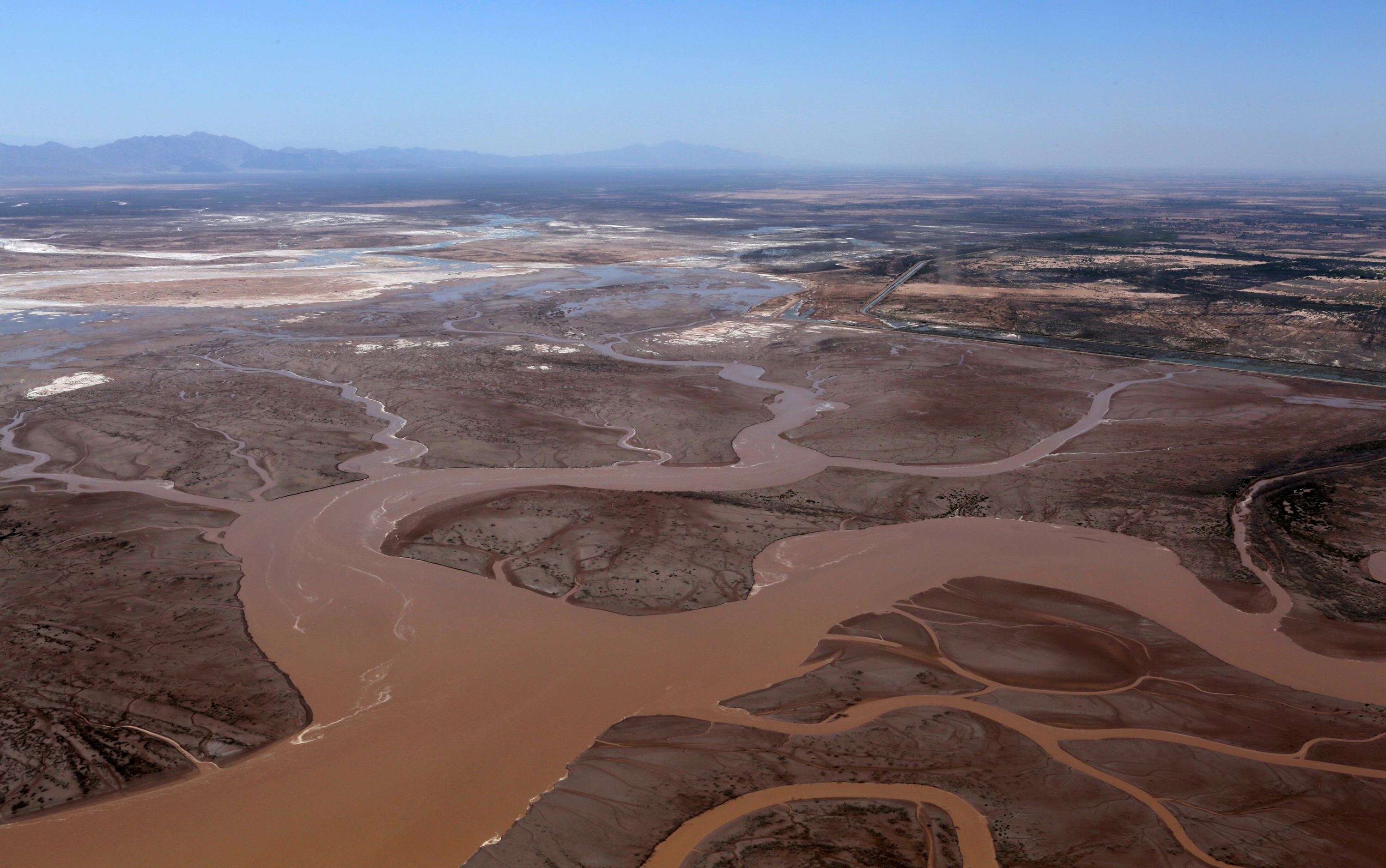 Water from the Colorado River flows into the Gulf of California in this photo taken on May 23, 2014. The short-term flush of water, which took place over eight weeks, had lasting ecological and social effects. Photo courtesy of Francisco Zamora/Sonoran Institute