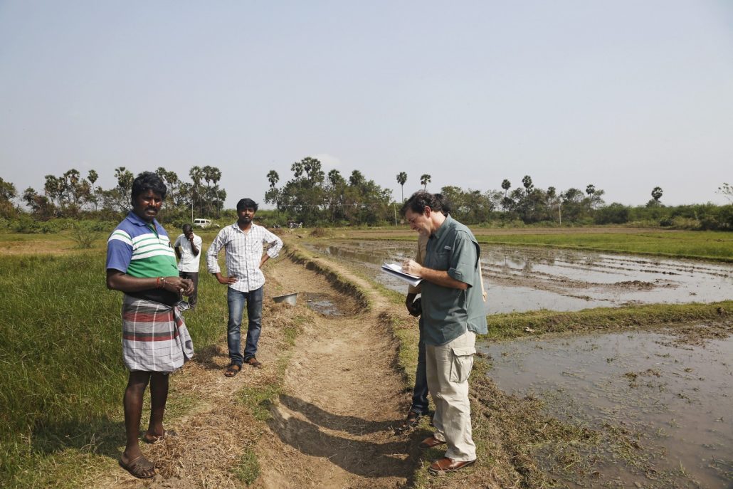 Keith Schneider interviews a local farmer (Keith has the farmers name written down) about the drought and using borewell groundwater for irrigation, in Chengalpet, Tamil Nadu. 
