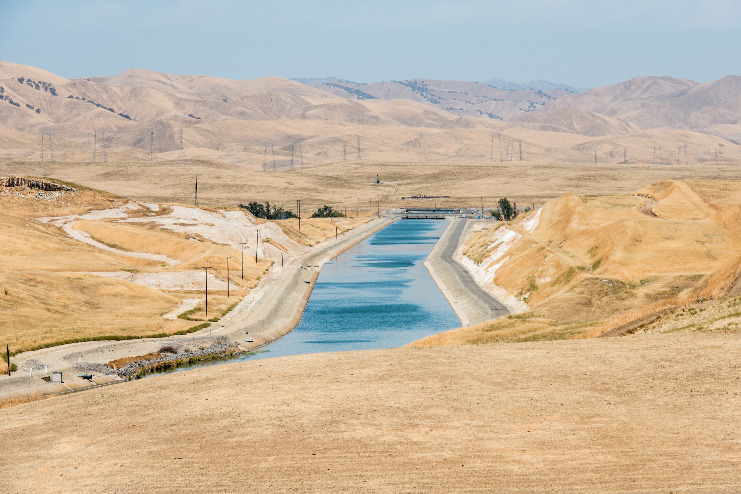 The California Aqueduct in Stanislaus County. Farms pumped so much groundwater during the state's recent drought that land around parts of the aqueduct sank, causing the canal to buckle. Photo courtesy of Florence Low / California Department of Water Resources