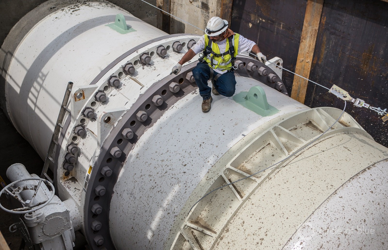 Los Angeles Department of Water and Power workers install a 144-inch pipe that will connect to an ultraviolet treatment plant.